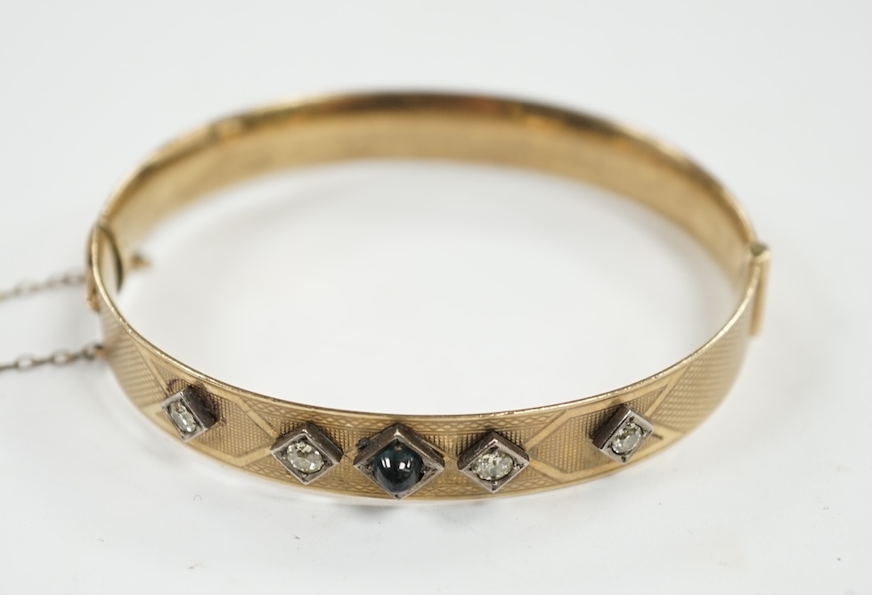 A Lagarmic diamond and green cabochon set 9ct and bronze core hinged bangle. Condition - fair